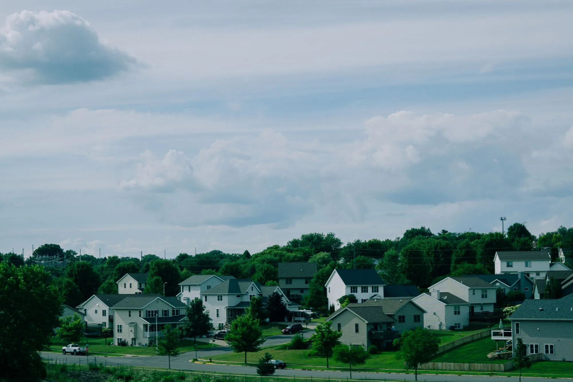 An open view across a suburban neighbourhood and its rooftops